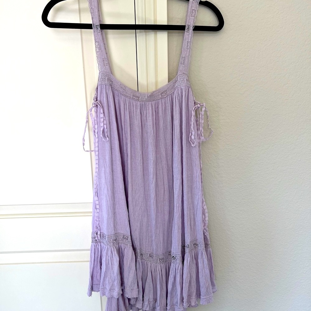 Free People loose fitting summer dress in lilac color . Size M can fit S .